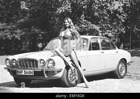 Reveille model Marilyn Coles seen here posing with a Jaguar, which is first prize in a Reveille car competition. Circa January 1972 Stock Photo