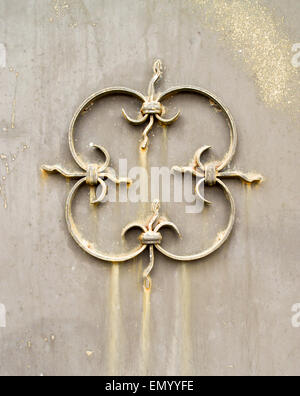 Barb iron design with rust bleeds on brown metallic paint Stock Photo