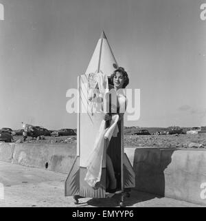 A woman tries out a new bathing machine at the Water Spalsh beach at St. Ouen's Bay on the Channel Island of Jersey. Its is in the form of a portabnle rocket and enables the bather to get changed from costume to clothes. Pictured is 22 year old Barbara Ho Stock Photo