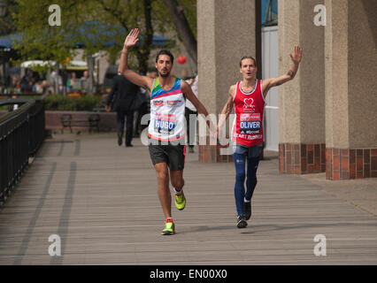 Tower Hotel, London, UK. 23rd April, 2015. Celebrity runners attend the celeb photocall 2 days before the Virgin Money 2015 London Marathon. Hugo Taylor and Oliver Proudlock, stars of the BAFTA award winning reality TV series Made in Chelsea. Credit:  Malcolm Park editorial/Alamy Live News Stock Photo