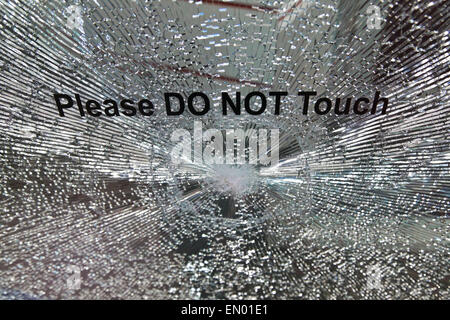 Smashed glass of a tinted glass on display at KL International Motorshow 2013. Stock Photo