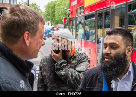 London, UK. 24th April, 2015. File Images: Islamist Abu Haleema seen here (centre) in May 2014 during an Islamist protest outside Regent's Park Mosque has passport seized by British police during morning counter-terror raids Credit:  Guy Corbishley/Alamy Live News Stock Photo
