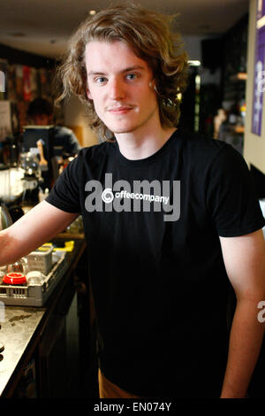 The Hague, Netherlands. 23rd Apr, 2015. A young men is seen preparing an espresso coffee in a cafe in the center of The Hague. Credit:  Willem Arriens/Alamy Live News Stock Photo