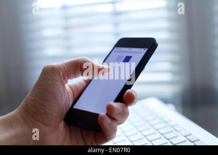 hand with smartphone Stock Photo