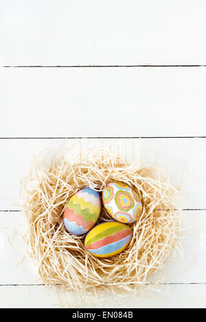 Colorful Easter eggs in nest Stock Photo