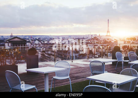 sunny terrace of restaurant in Paris with panoramic view on Eiffel tower, France Stock Photo