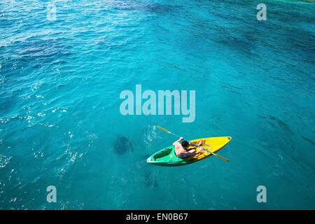 top view of man paddling on kayak in turquoise water Stock Photo