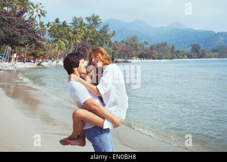 happy young family on the beach, couple during honeymoon Stock Photo