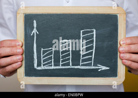 doctor hands showing chalkboard with chart Stock Photo