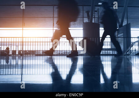 abstract airport background with walking commuters Stock Photo