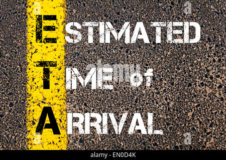 Business Acronym ETA as ESTIMATED TIME OF ARRIVAL. Yellow paint line on the road against asphalt background. Conceptual image Stock Photo