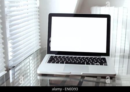 laptop with empty screen in modern interior Stock Photo