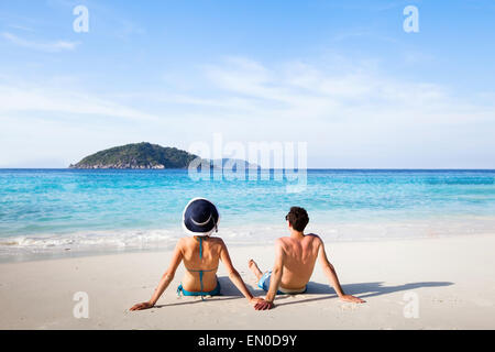 honeymoon destination, young happy couple relaxing on paradise beach Stock Photo