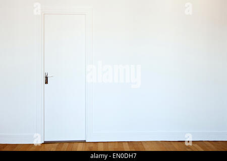 white door on white wall, real estate background Stock Photo