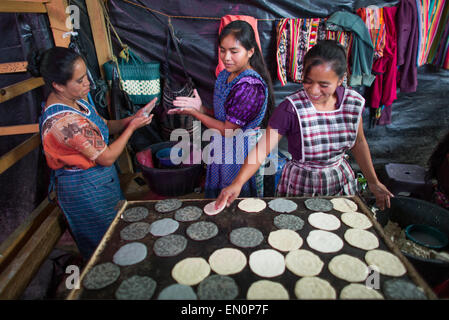 cook at work in Guatemala city market Stock Photo