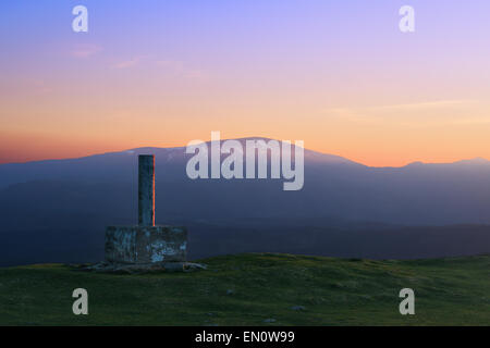 trig point in Urkiolamendi with view of the Gorbea mountain Stock Photo