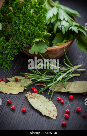 Fresh herbs and spices on wooden table Stock Photo