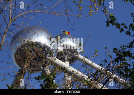 The Belgium flag flies over the top of the Atomium in Brussels, Belgium Stock Photo