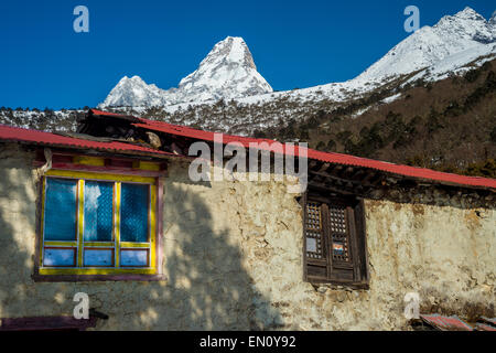 Traditional sherpa house in the himalayas region, with Ama Dablam peak in the background Stock Photo