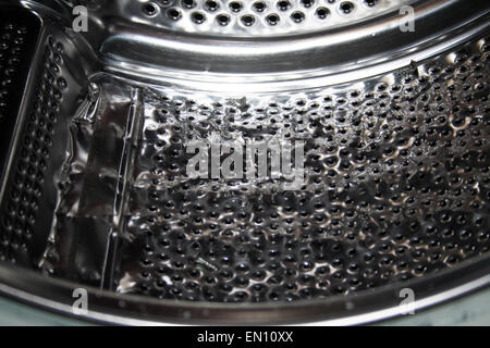 Close-up of a damaged washing machine drum. Stock Photo