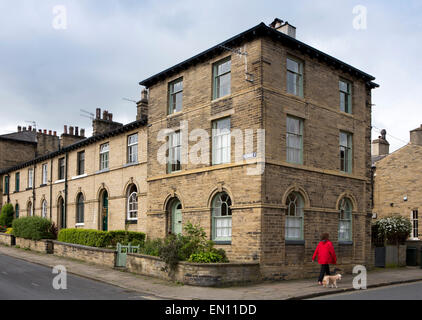 UK, England, Yorkshire, Saltaire, George Street, large house at end of terrace of workers homes Stock Photo