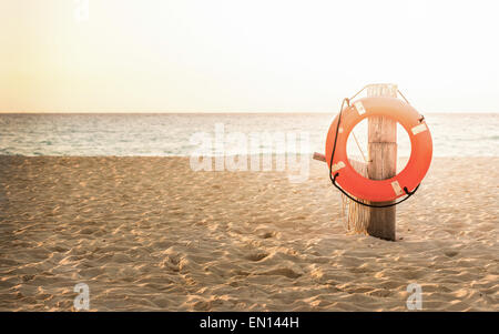 Life preserver on sandy beach somewhere in Mexico Stock Photo