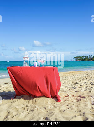 Party table on caribbean beach Stock Photo