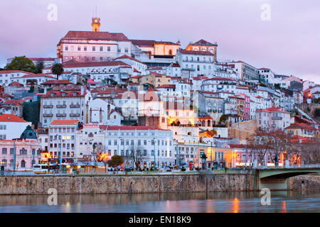 The skyline of the old centre of the medieval city of Coimbra, with the university and upper city on top of the hill and the Mondego River, Portugal Stock Photo