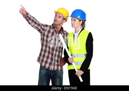 Woman with flat top, pointing to operator Stock Photo