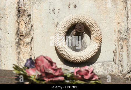 Focus on a stone wreath on a tomb in Pere Lachaise Cemetery Paris France Europe Stock Photo