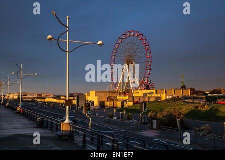 Fairground and esplanade at Southport, Merseyside, UK 25th April, 2015 UK Weather. Colourful sunset over Southport attractions of Pleasureland, Ocean Plaza and Marine Drive. Stock Photo