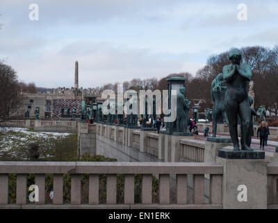 Side view of Gustav Vigeland's installation in the Frogner park with bronze sculptures and his famous monolith in background. Stock Photo