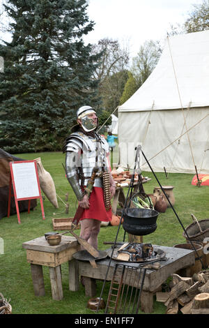 A Roman soldier from the Ermine street guard on display next to a fire. Credit:  Scott Carruthers/Alamy Live News Stock Photo