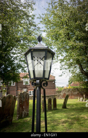 Lamp in churchyard with crossed swords on the glass Stock Photo