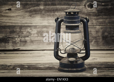 Vintage concept of a old lantern on rustic wood Stock Photo