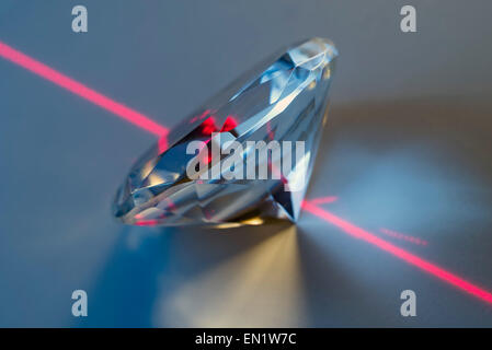 closeup of a laser beam impacting on a cut crystal in a diamond Stock Photo