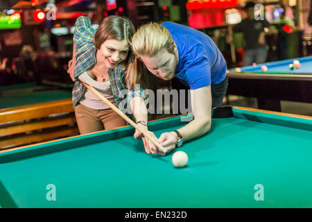 Young couple playing pool Stock Photo