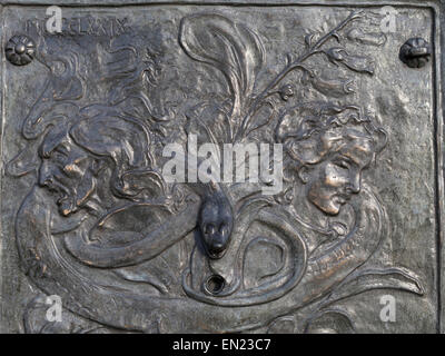 Bronze plaque on Fountain in Edinburgh City near site of witch burning. By John Duncan. Stock Photo