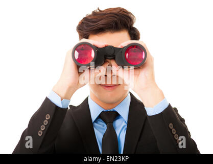 Businessman looking through binoculars and searching Stock Photo