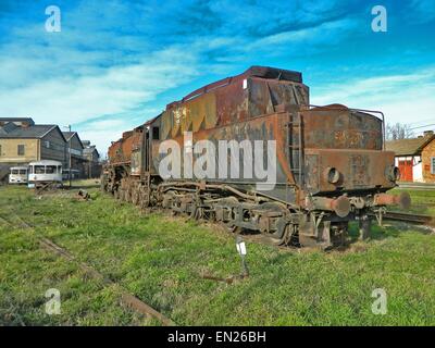 Large, old steam locomotive, which for years waiting for repair and Museum. Stock Photo