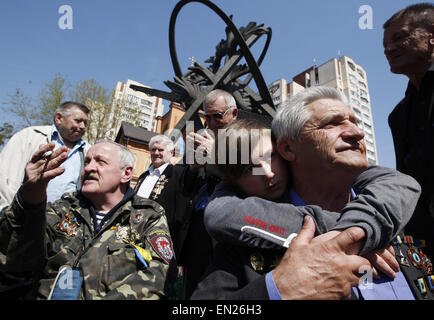 Kiev, Ukraine. 26th Apr, 2015. A former liquidators of the Chernobyl nuclear accident attends a commemoration ceremony at the Chernobyl victims' memorial in the Ukrainian capital of Kiev on April 26, 2015. The world marks the 29th anniversary of the world's worst nuclear disaster at Chernobyl nuclear pant in Ukraine. The explosion at reactor number four of the Chernobyl power plant in the early hours of April 26, 1986 sent radioactive fallout into the atmosphere that spread from the Soviet Union across Europe. © Serg Glovny/ZUMA Wire/ZUMAPRESS.com/Alamy Live News Stock Photo