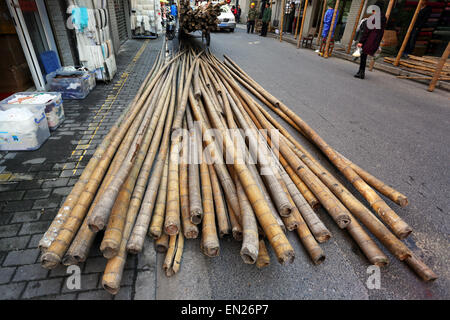 Bamboo scaffolding poles used for building and construction, Shanghai, China Stock Photo