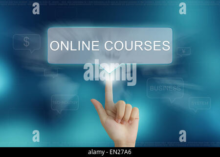 hand pushing on online courses balloon text button Stock Photo