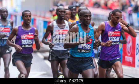 London, UK. 26 April 2015. Eliud Kipchoge (Kenya), second right, in the elite men group at mile 13 at The Highway, during the 2015 Virgin Money London Marathon. Kipchoge would go on to win the race in a time of 2:04:42. Credit:  Stephen Chung / Alamy Live News Stock Photo