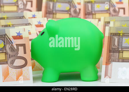 Piggy bank and Euro banknotes Stock Photo