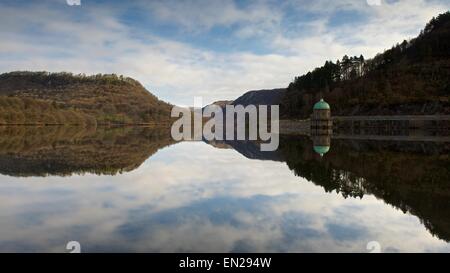 A colour image taken int he morning of the reflections in the Elan Valley, near Rhayader in Mid wales of the straining tower Stock Photo