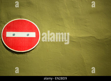 No entry sign attached to yellow brown painted wall Stock Photo