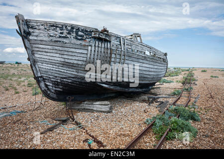 Old abandoned wreck of fishing boat, Dungeness, Kent, England, UK Stock Photo