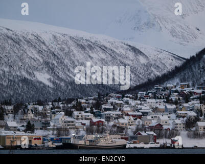 The houses on the bottom of the hill covered with snow viewed from Tromso (Norway) Stock Photo