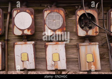 Electrical boxes exposed outside rust away going unused Stock Photo